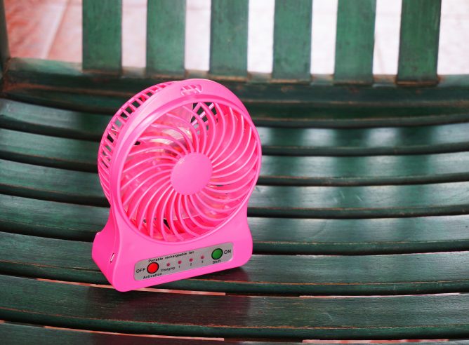 Portable Fan USB on the wood chair